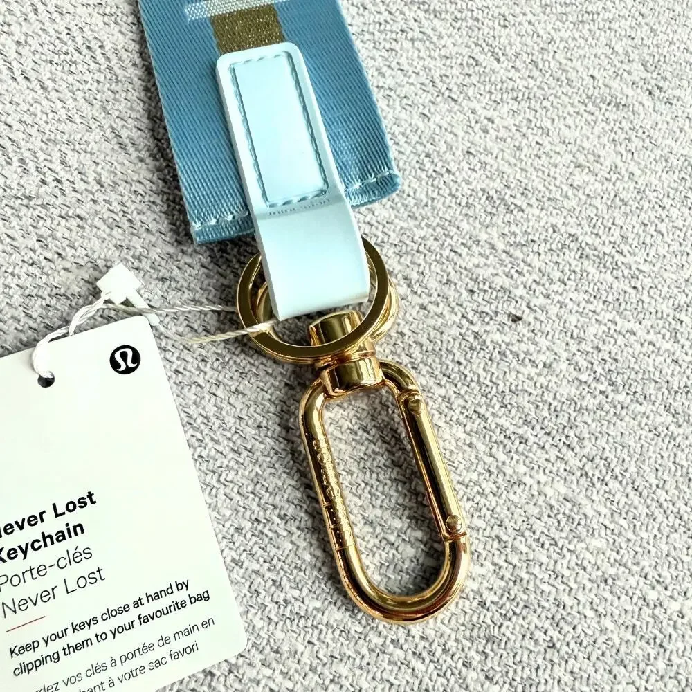 NEW Lululemon Never lost Keychain Wordmark Baby Blue Gold